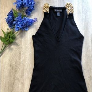 Black v cut tank top with gold chain straps